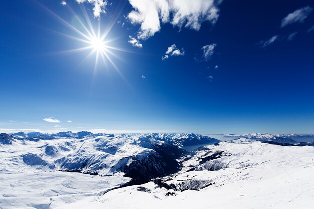 View down on typical Alpine ski resort and ski slopes
