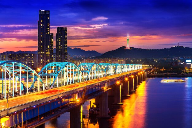 View of downtown cityscape at Dongjak Bridge and Seoul tower over Han river in Seoul, South Korea