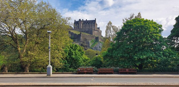 View of the Edinburgh Castle. Greenery, street. United Kingdom, Scotland