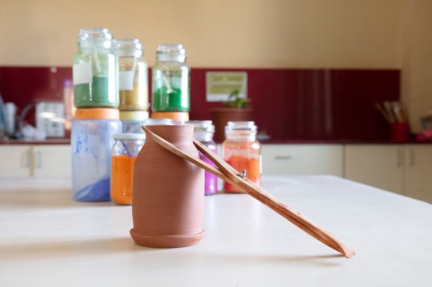 Free photo view of essentials in a pottery studio