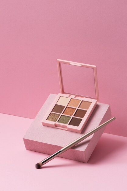 View of eyeshadow palette with brush applicator