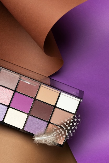 Free photo view of eyeshadow palette with shades of cosmetic powder
