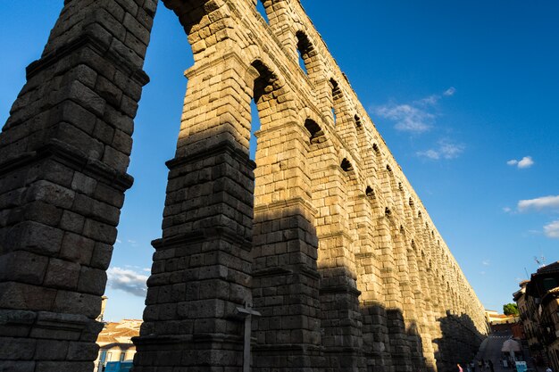 View of the famous Aqueduct of Segovia with beautiful shadow