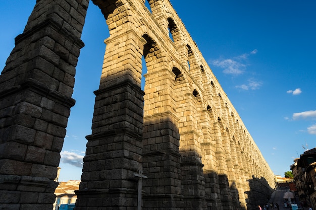 View of the famous Aqueduct of Segovia with beautiful shadow