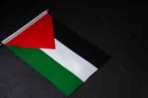 Free photo above view of flag of palestine on dark surface