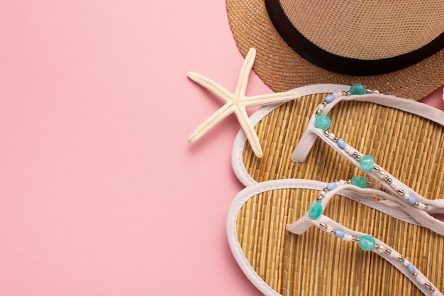 View of flip flops with summer essentials and starfish