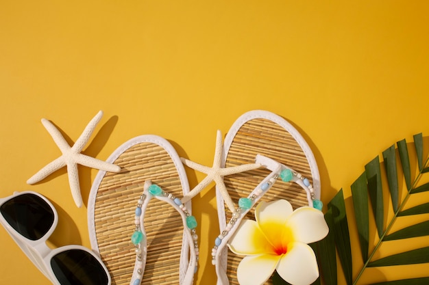 View of flip flops with summer essentials and starfish