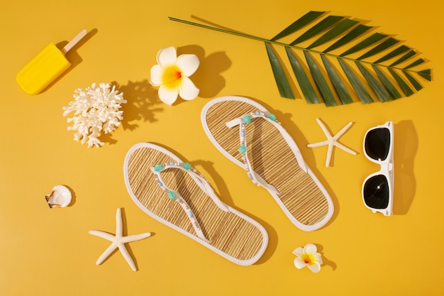 View of flip flops with summer essentials and starfish