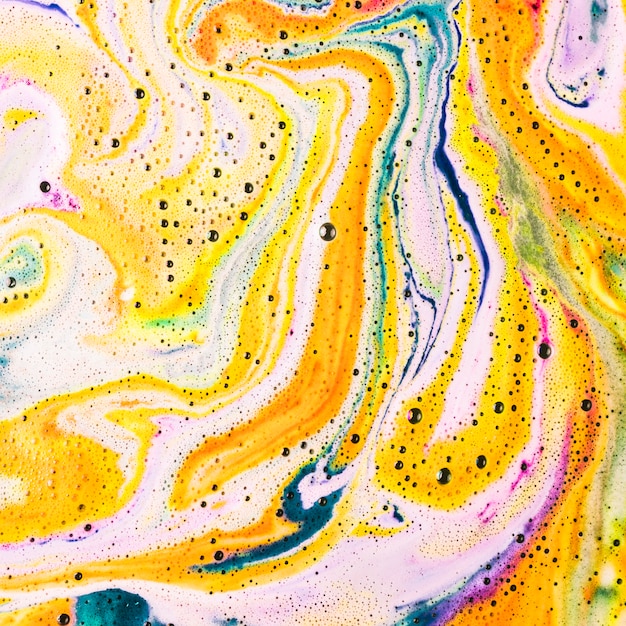 View of foam after dissolving color bath bomb in water