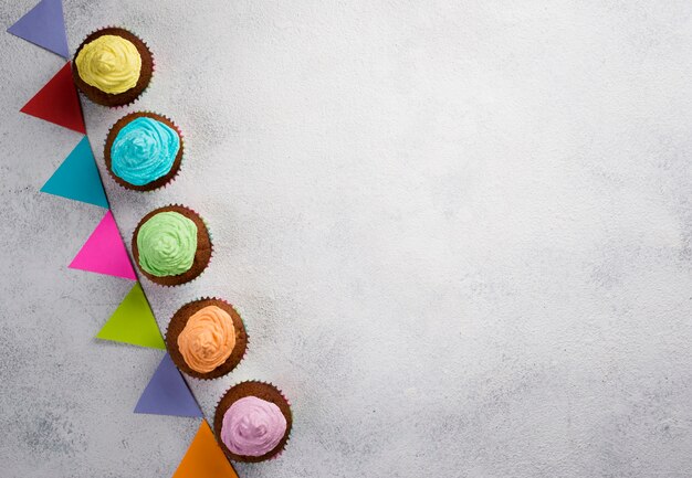 Above view frame with muffins and white background