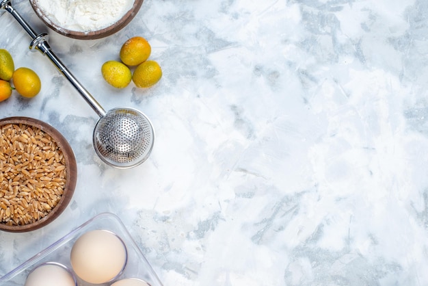 Above view of free space and ingredients for the healthy foods selection on the right side on ice background