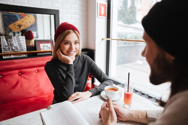 View from back of bearded man on date with woman