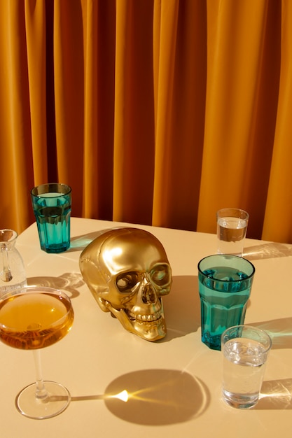 Free photo view of golden skull with alcoholic drink