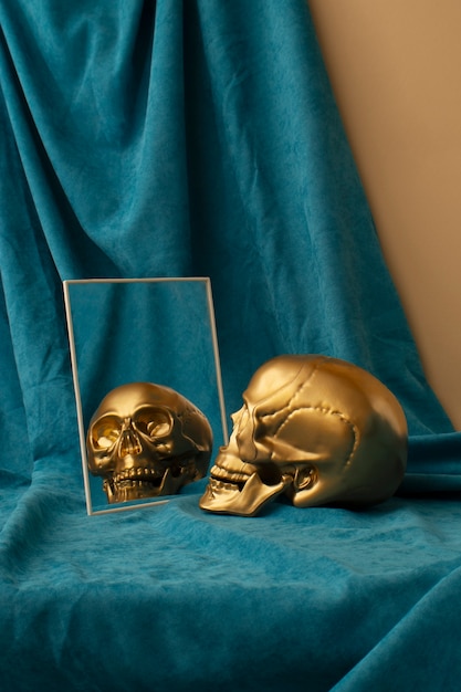 Free photo view of golden skull with mirror