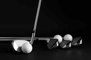 Free photo view of golf balls with metallic clubs