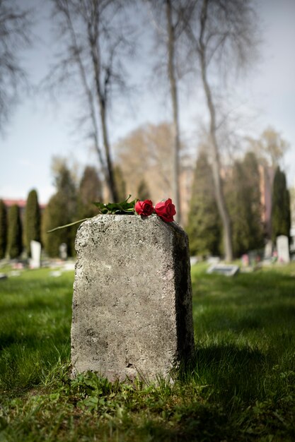 View of gravestone with flowers