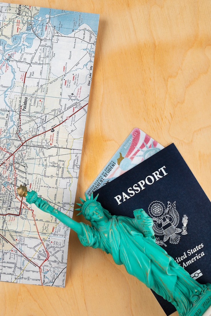 Free Photo above view green card and passport arrangement