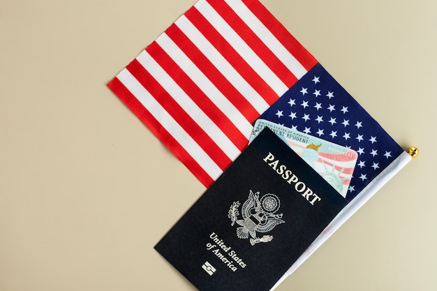 Free photo above view green card and passport