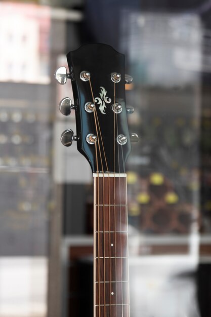 View of guitar in musical instruments store