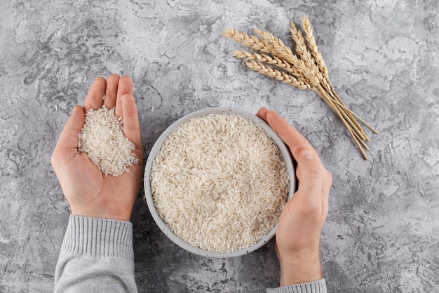 Above view hands holding rice