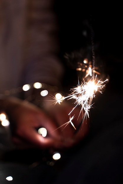 View of hands holding sparkles