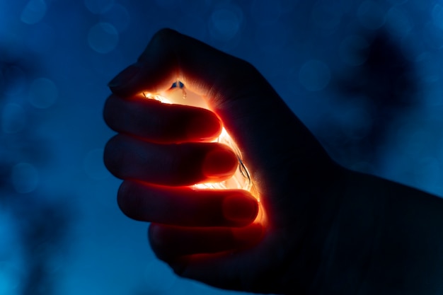 Free photo view of hands tiny lights