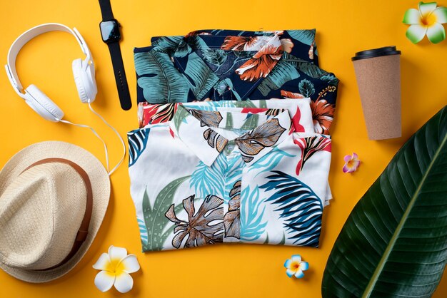 View of hawaiian shirts with coffee cup and hat