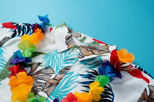 View of hawaiian shirts with floral print and garland