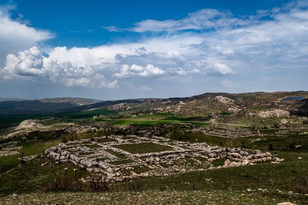 View of a Hittite ruins, an archaeological site in Hattusa, Turkey on cloudy day