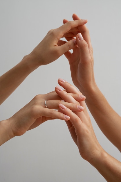 Free photo view of human hands against clear background