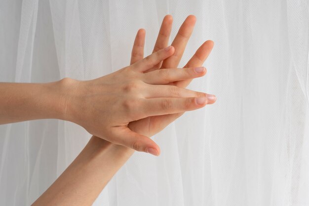 View of human hands against clear background