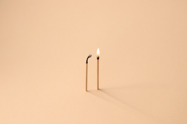 View of lit wooden matchsticks