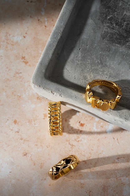 View of luxurious golden ring on rock or concrete tray