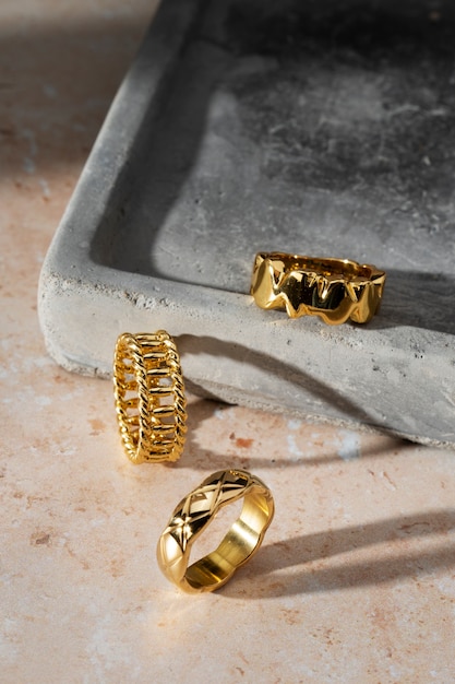 View of luxurious golden ring on rock or concrete tray