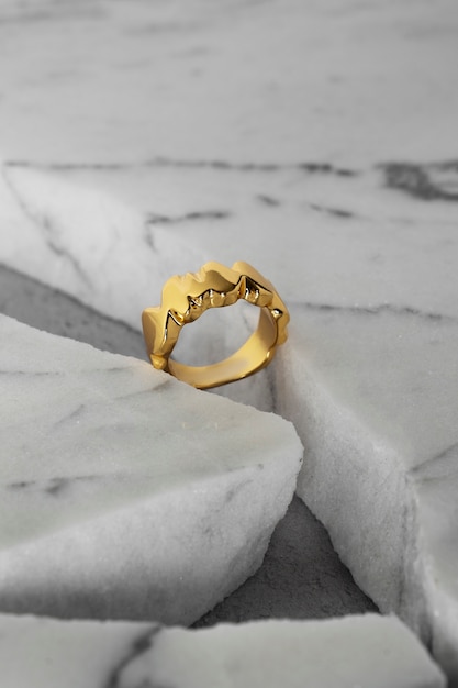 Free photo view of luxurious golden ring with marble