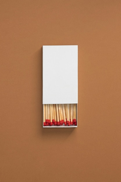 Free photo view of matchbox with wooden matchstiks