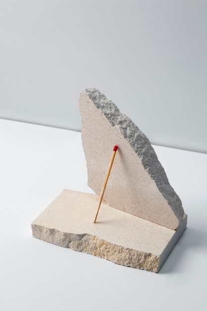 View of matchsticks with slab of stone