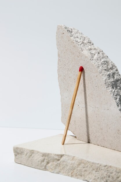 View of matchsticks with slab of stone