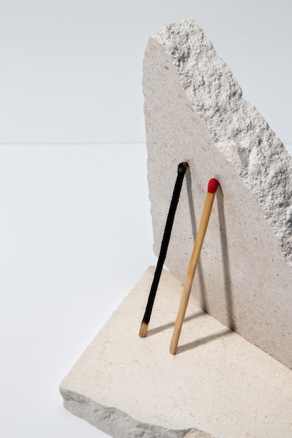 View of matchsticks with slab of stone