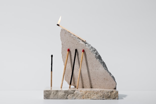 View of matchsticks with slab of stone