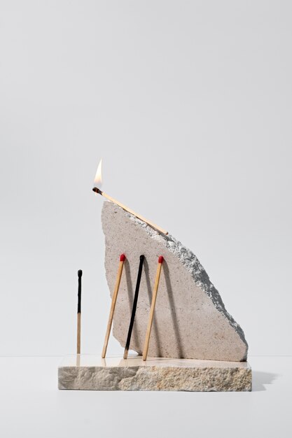 View of matchsticks with slab of stone