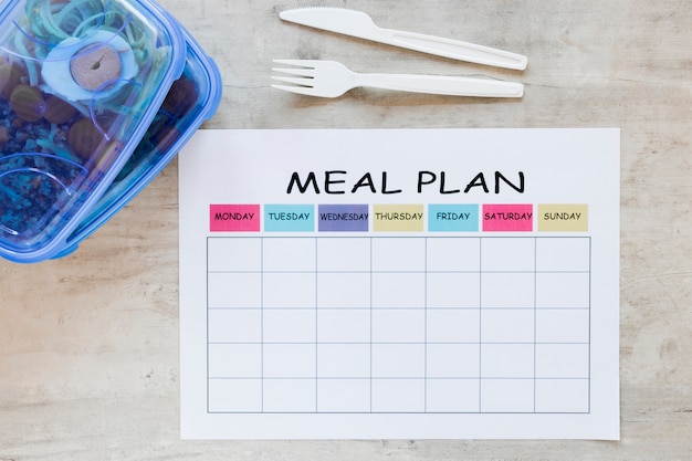 Above view meal container with planner