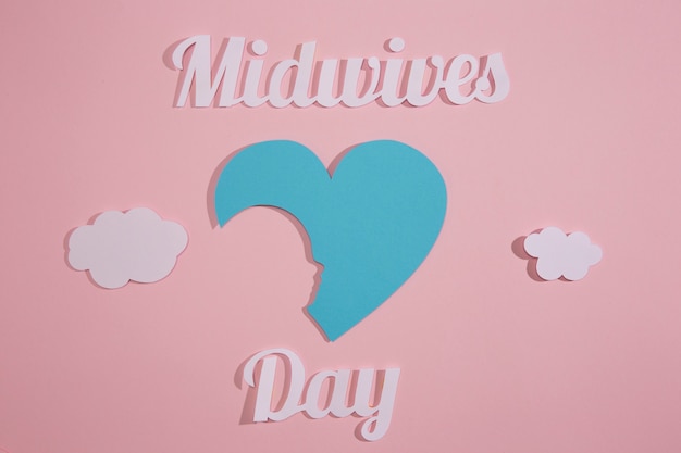 Above view midwives day celebration with pink background