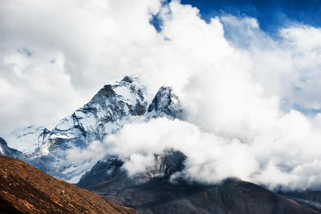 View of mount ama dablam with clouds in himalaya mountains. khumbu valley, everest region, nepal