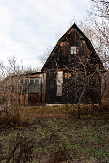 View of old and abandoned house in nature