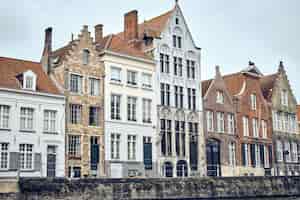 Free photo view of an old town of bruges in belgium on a white sky