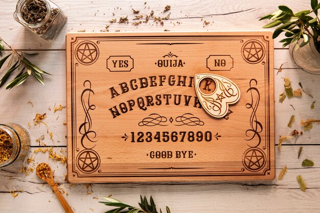 Above view ouija board on wooden table