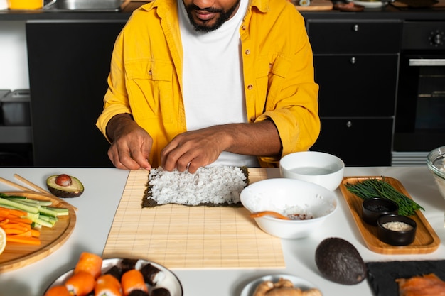 View of people learning how to make traditional sushi dish