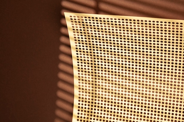 View of perforated sheet of material with tiny holes