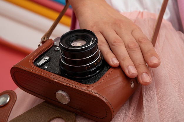 Free photo view of person holding professional digital camera